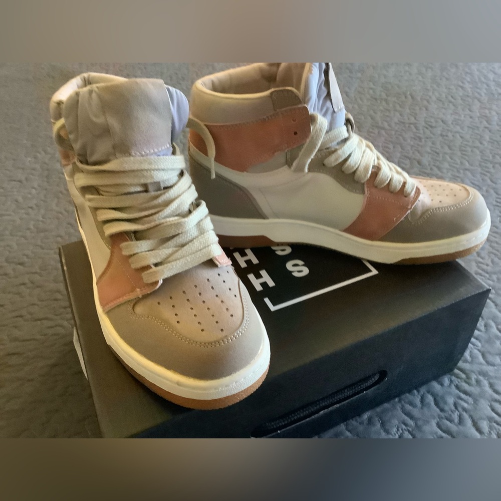 Shu Shoe new high top sneakers never been worn.